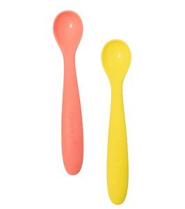 An orange and a yellow silicone baby spoon on white background