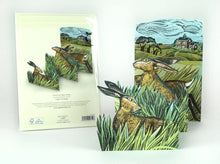 Load image into Gallery viewer, Hares &amp; Open Fields Concertina Card by Angela Harding | Art Angels