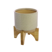 Load image into Gallery viewer, One HomArt Ames Cachepot in light gray with dark speckles throughout sitting on wooden stand against white background