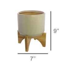 Load image into Gallery viewer, One HomArt Ames Cachepot in light gray with dark speckles throughout sitting on wooden stand against white background. Line running across bottom indicates it measures 7&quot; across and line running along right indicates it measures 9&quot; tall