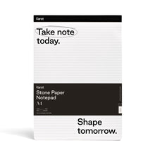 Load image into Gallery viewer, Image of white and black notepad on white background; Thin black line runs across top of notepad with &quot;KARST&quot; printed on top right corner; Below, on white background with black lines running across, reads &quot;Take note today.&quot; with a black circle around &quot;Take note&quot;; Large black rectangle runs across pad half way down and reads &quot;KARST&quot; &quot;Stone Paper Notepad&quot; &quot;A4&quot;; Bottom section of pad is white with black lines and in bottom corner, in black, reads &quot;Shape tomorrow.&quot;